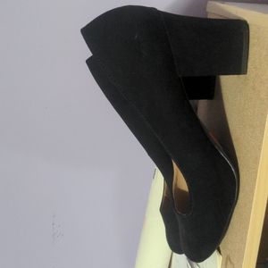 Almond toe black suede pumps